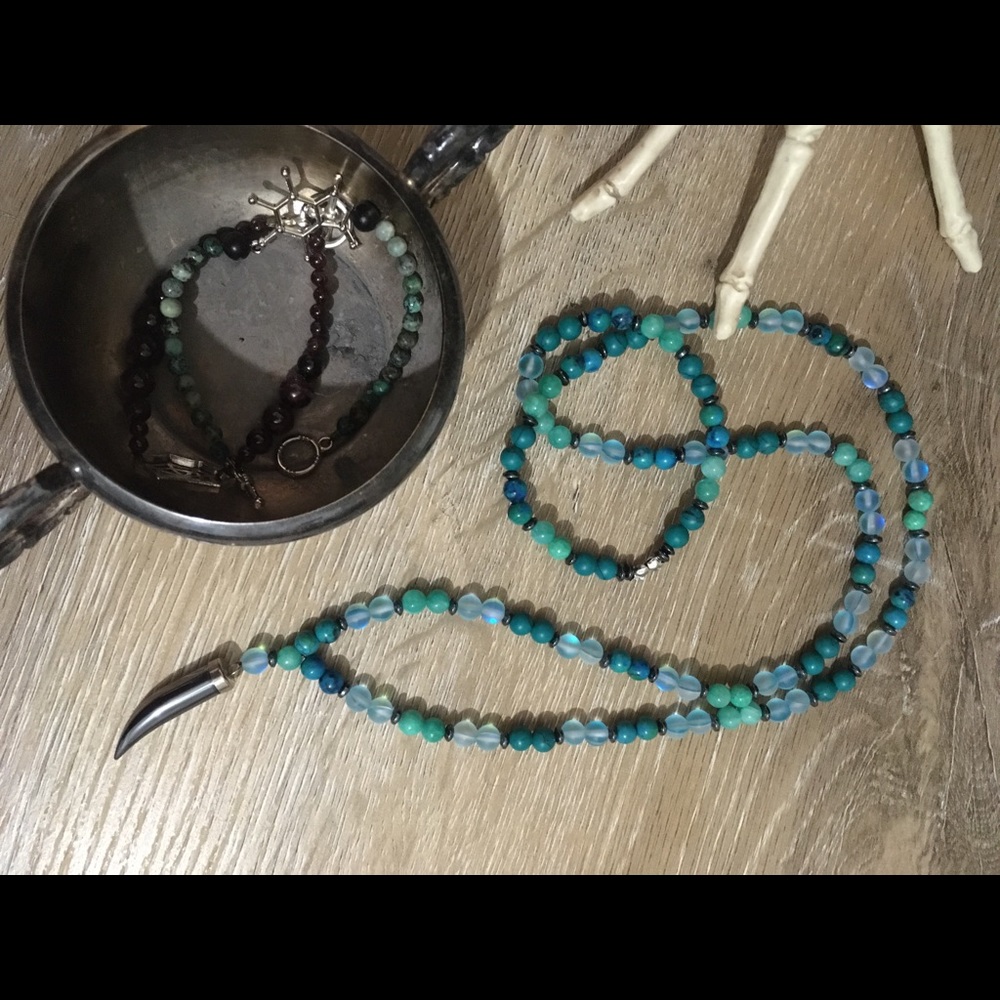 Teal crystals with hematite tooth pendant